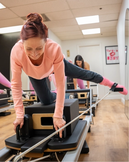 Instructor on reformer machine